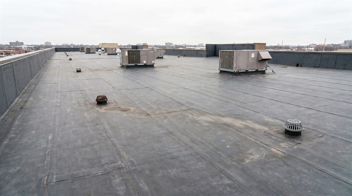 Flat commercial roofing membrane on an Edmonton building